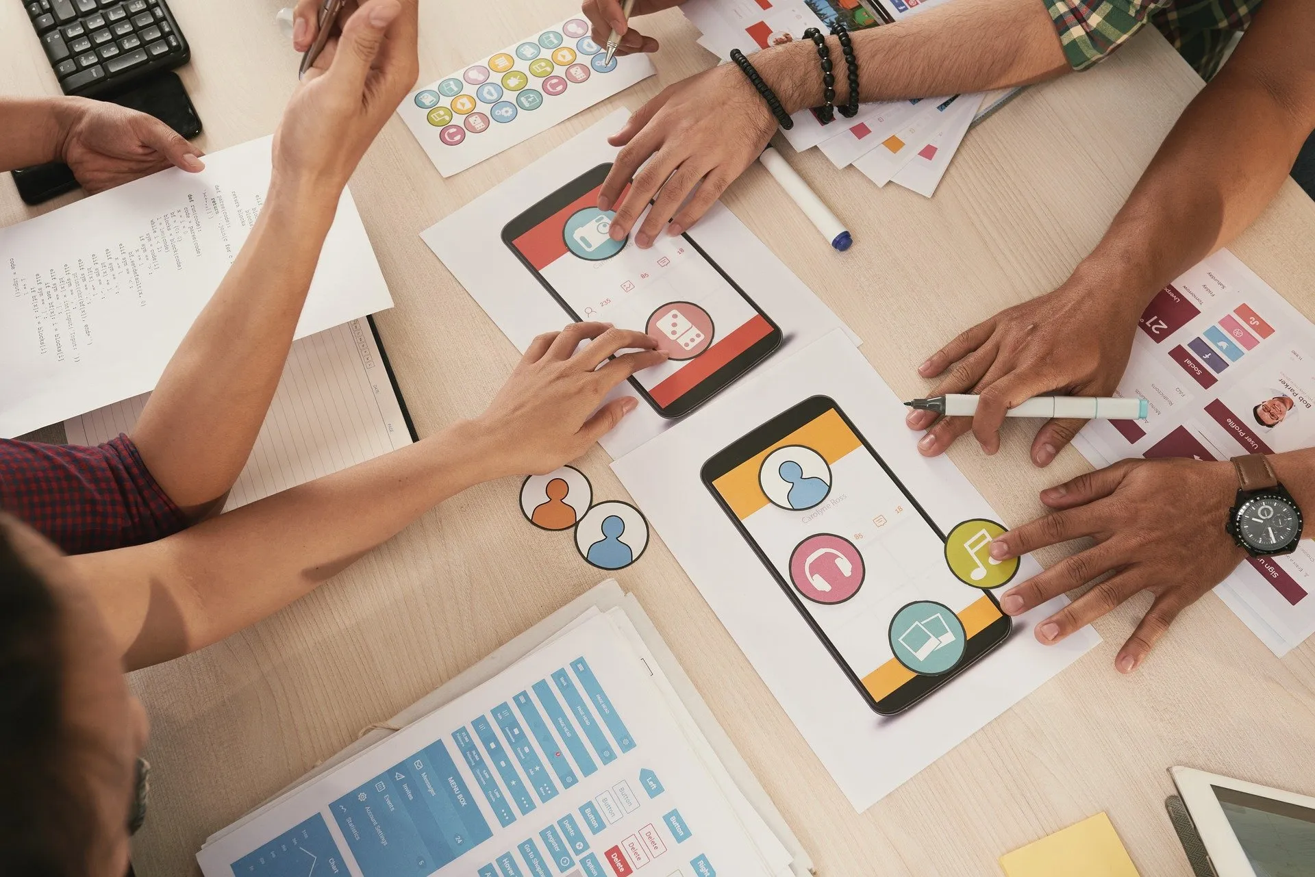 Team collaborating around software architecture diagrams